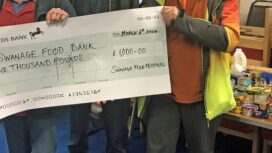 Cheque from Swanage Folk Festival donated to Swanage Food bank