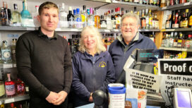 Retiring managers of the Corfe Castle Village Stores, Carole and Terry Birnie welcome in their replacement, Carl Seaward