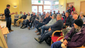 Luke Robinson addresses the public meeting to discuss plans for a seaweed farm in Swanage